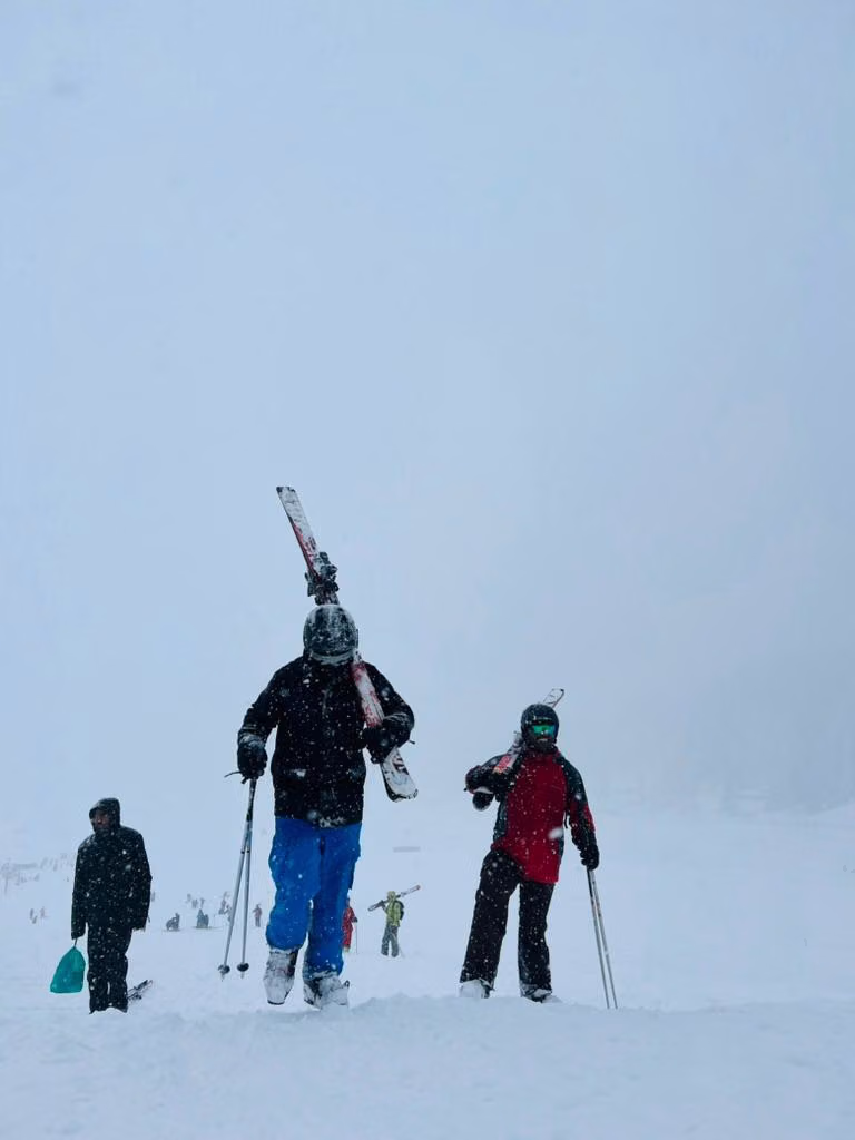 Skier practising linked turns on a gentle groomed run